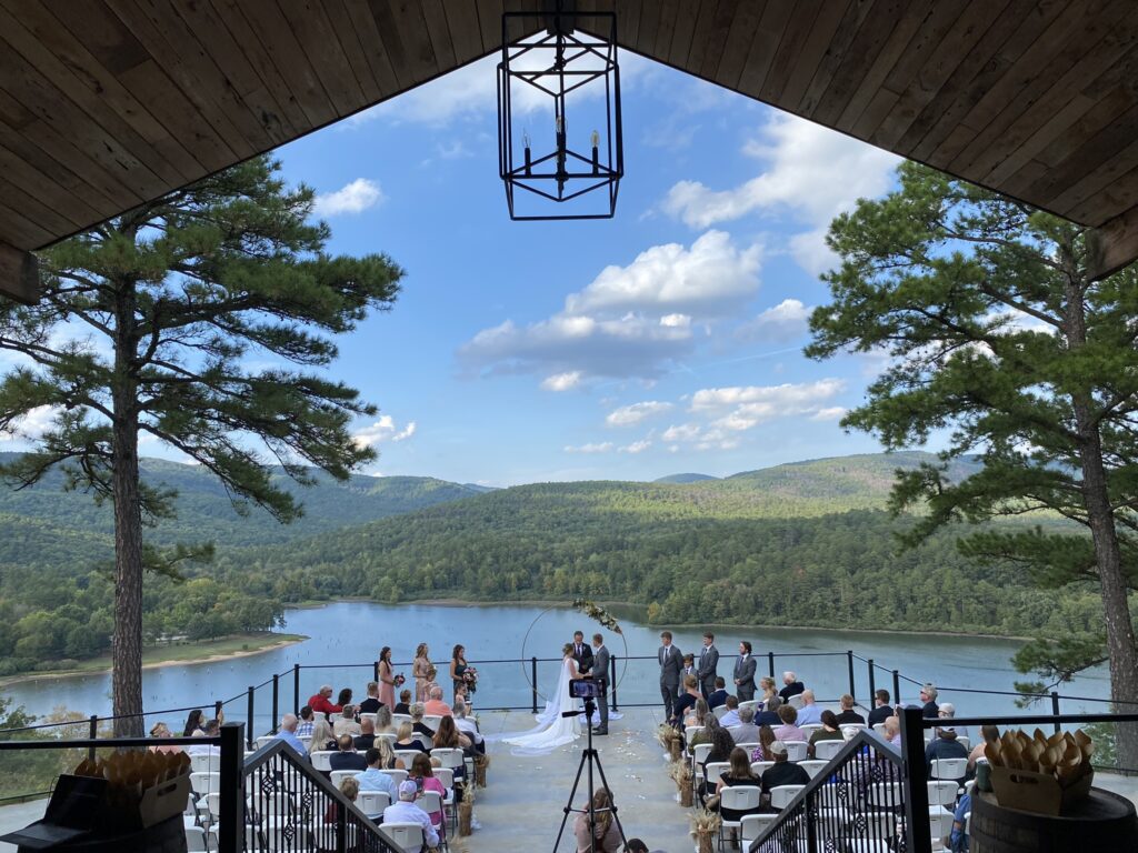 A wedding ceremony is set up on the deck.