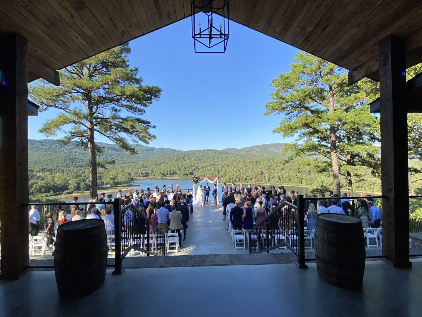 A wedding ceremony is set up in front of the mountains.