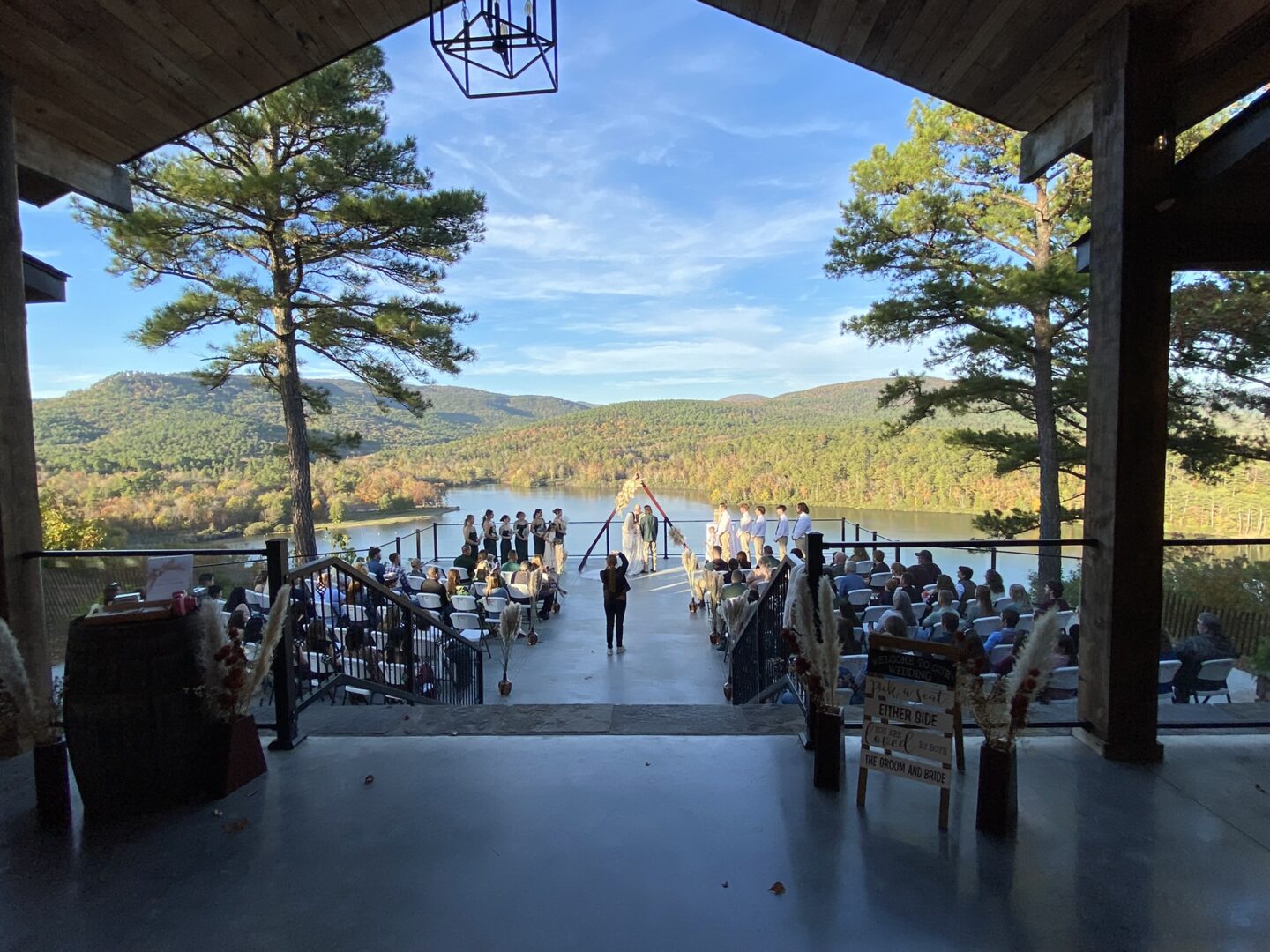 A wedding ceremony is being held on the deck.