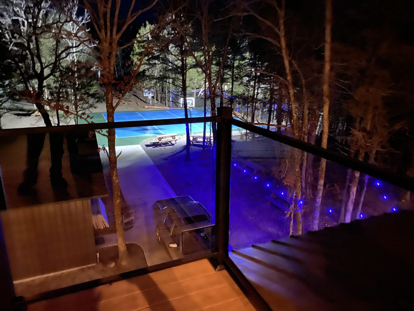 A view of the pool from above at night.