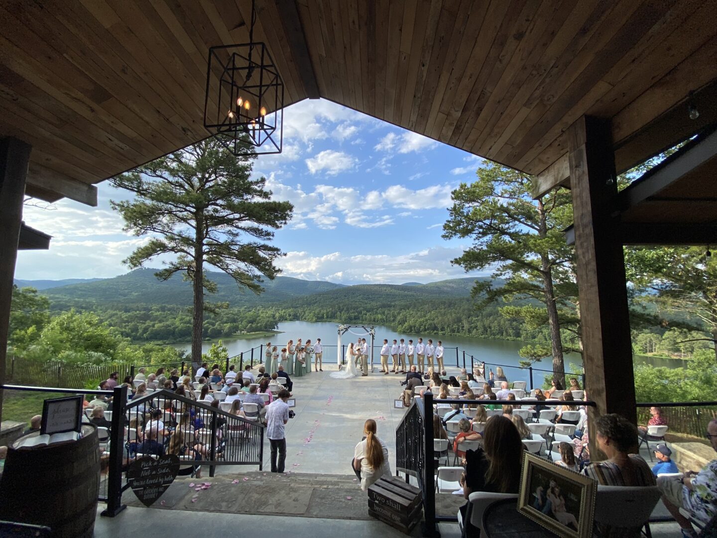 A wedding ceremony is set up on the patio.