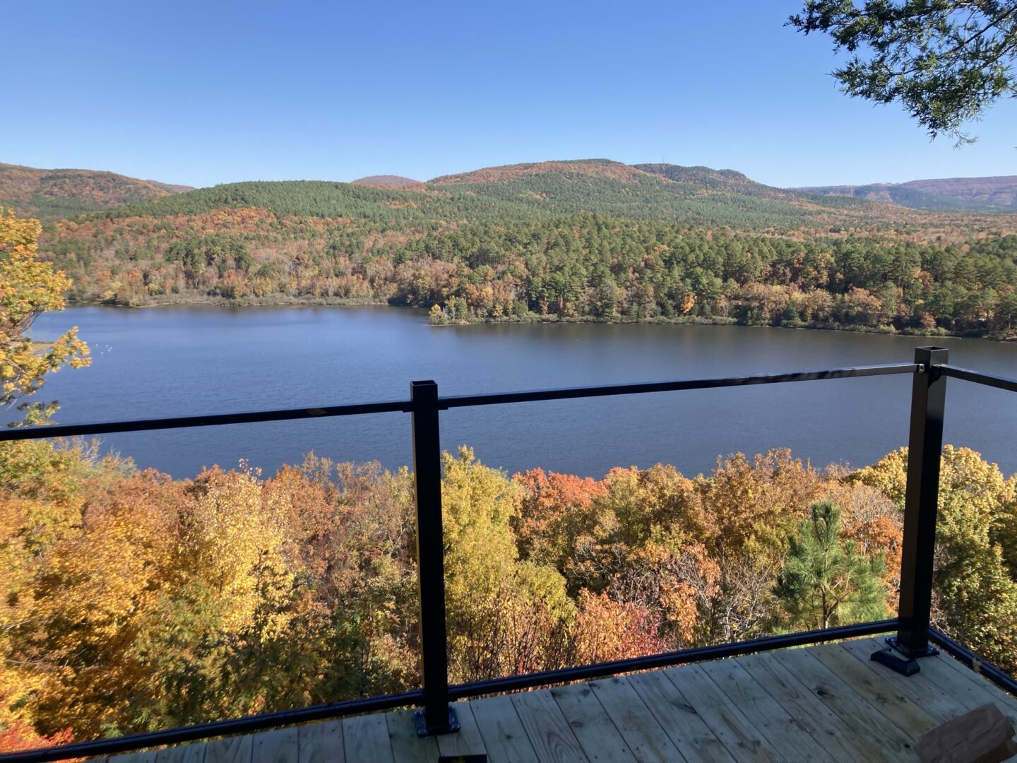 A view of the lake from a deck in autumn.