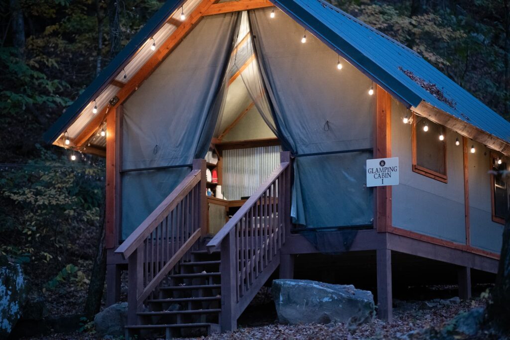 A tent with lights on the outside of it